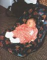 This is me at home in my car seat that my WONDERFUL Uncle Martin GENEROUSLY bought me.